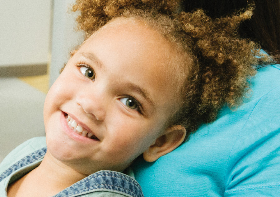 A young girl smiling