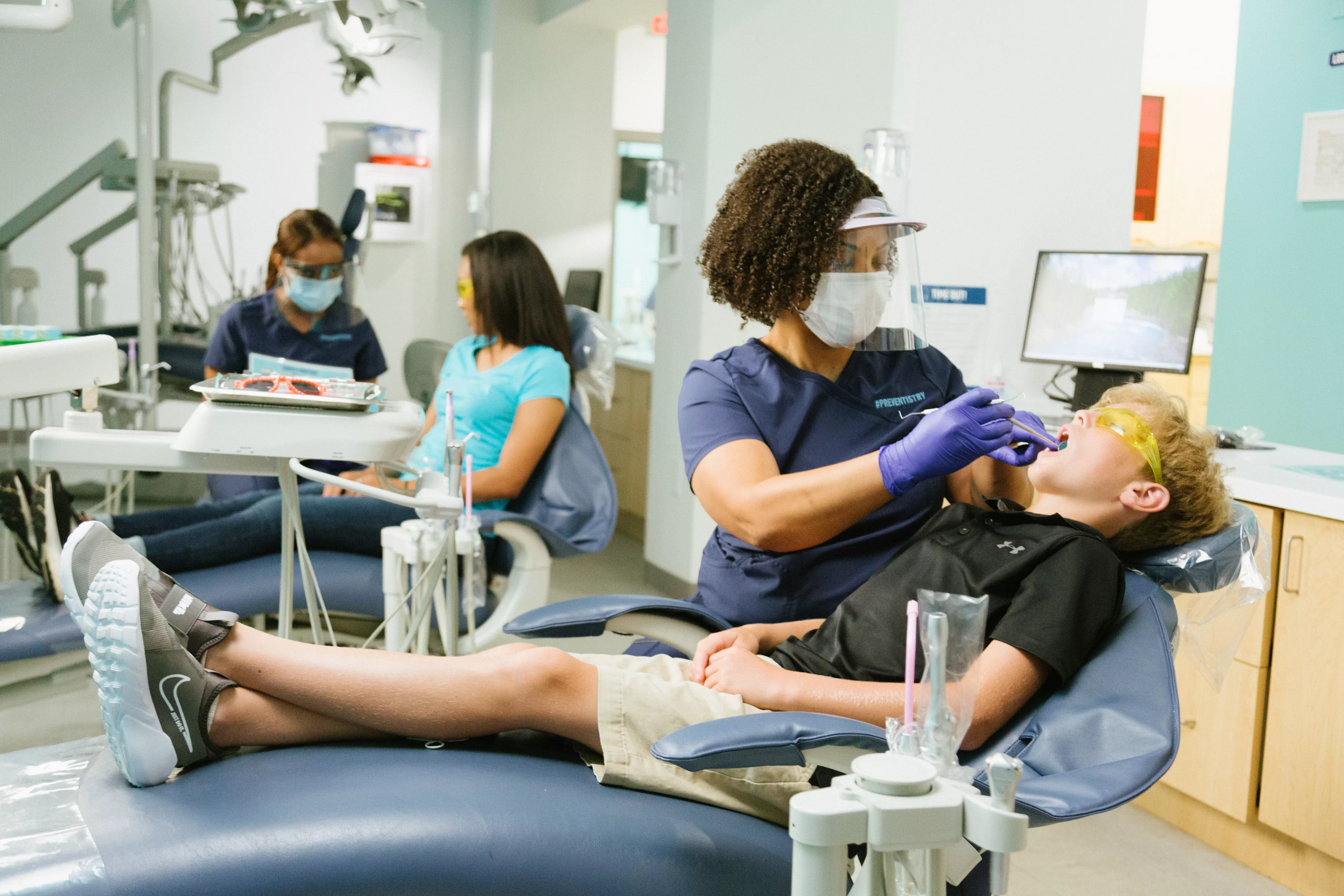 Patients receiving oral health care at Advantage Dental+.