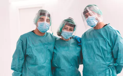A team of medical professionals posing for a photo.