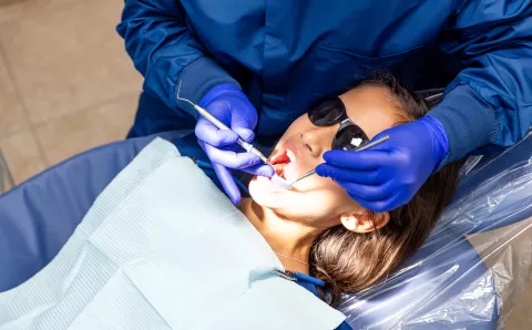 A young girl undergoing their routine dental check-up.