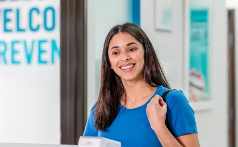 A patient checking in for her dental appointment.